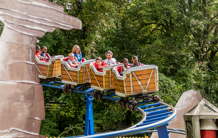 kids on small roller coaster